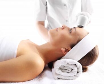 esthetician using ultrasound tool for skin care in Guelph